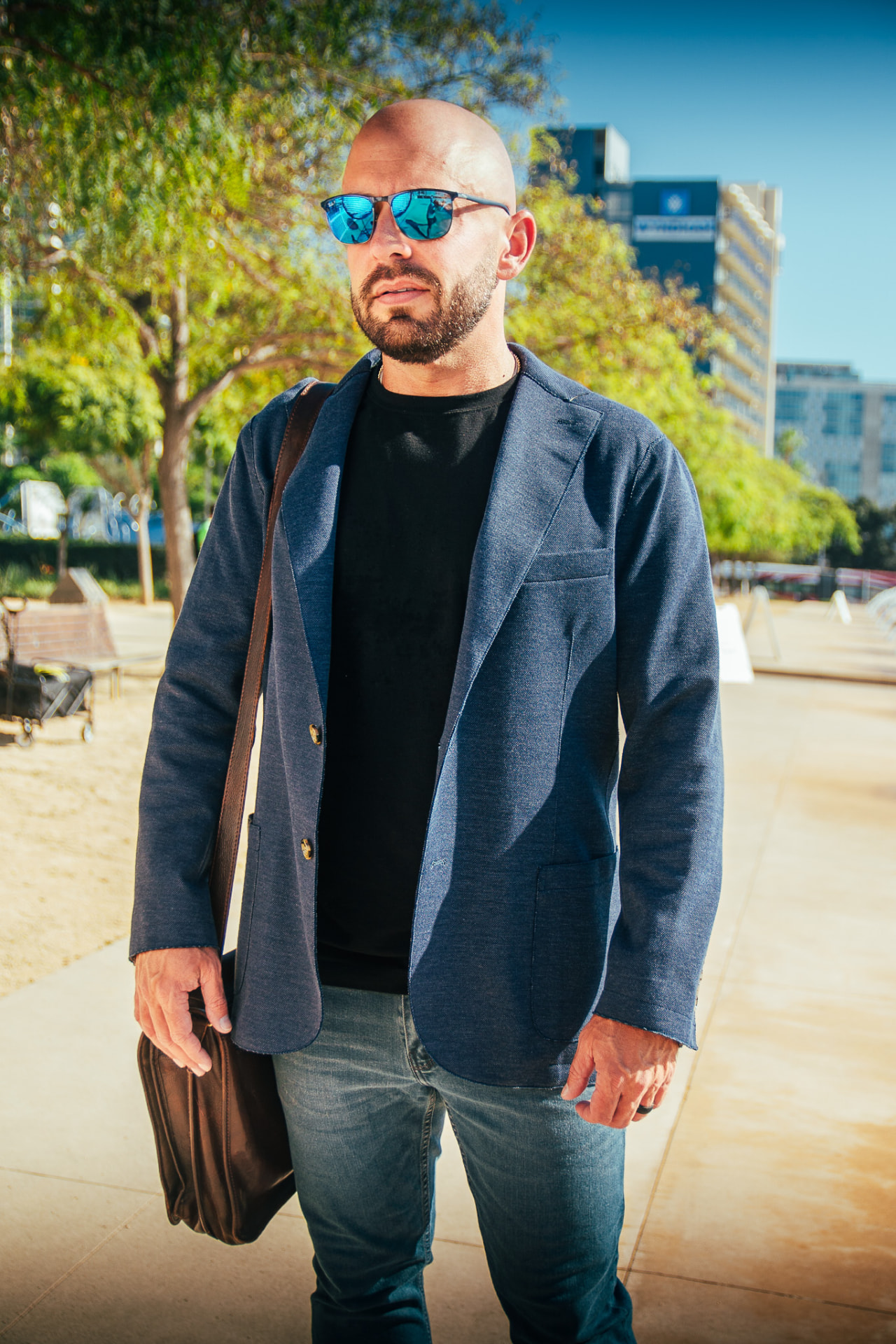 Ernie Beltz Jr. standing outside in a blue jacket